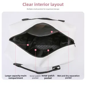 Detail view of large-capacity white travel bag interior with dry and wet separation layers