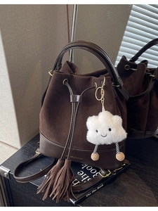 Vintage dark brown bucket backpack in suede and leather with tassel and plush charm