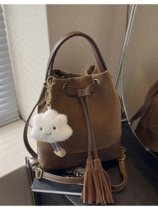 Retro brown suede bucket bag with leather trim and plush cloud charm for women