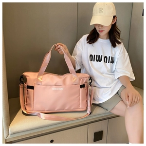 Macro view of soft pink waterproof travel bag with adjustable strap and large capacity