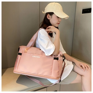Detail of pink large capacity travel bag with bottom shoe compartment and wet pocket