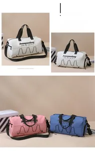 Three waterproof duffel bags in white, pink, and blue with adjustable shoulder straps