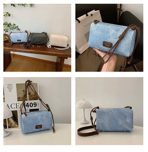Detail view of retro denim mini crossbody bag with unique rope straps and leather patch