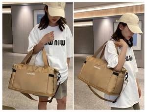Lifestyle view showing the khaki travel bag being carried as a shoulder and crossbody bag