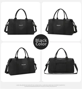 Detail view of black oxford fabric sports bag with durable handles and adjustable strap