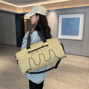 Large beige waterproof sports bag for gym and travel featuring durable shoulder straps