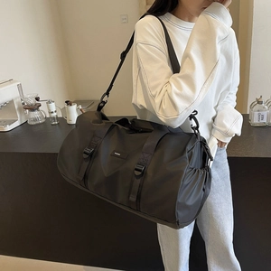 Black large capacity Oxford cloth travel bag with handles and adjustable shoulder strap