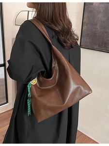Brown large capacity leather tote bag for women with green woven smiley face charm