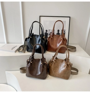 Detail view of four vintage bucket bags with retro jacquard straps in multiple colors