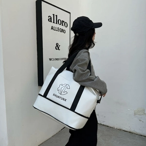 Large white travel tote with black trim and KC XHUAYUNX logo for weekend trips