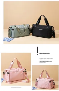 Detail view of large travel bags in black and sage green with waterproof nylon texture