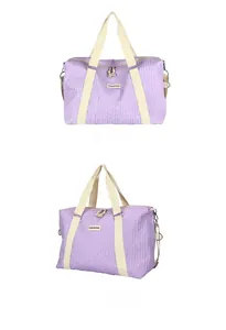 Detail view of purple travel bag featuring a unique bubble texture and fabric logo patch