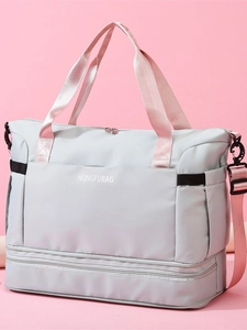 Light gray large capacity travel bag with pink handles and separate shoe compartment