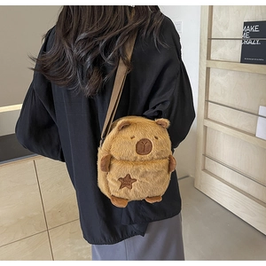 Detail of Capybara plush crossbody bag featuring star embroidery and soft fur texture