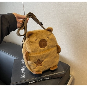 Detail of Capybara plush crossbody bag featuring soft fur and adjustable shoulder strap