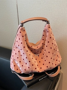 Pink velvet hobo tote bag with burgundy polka dots and a silver metal bow accessory