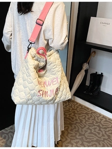 Quilted cream tote bag with pink straps and embroidery for students and commuters