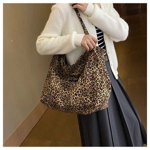 Close-up of leopard print canvas tote bag showing large capacity for daily commuting
