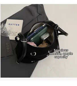 Spacious black corduroy tote bag showing large capacity for electronics and accessories