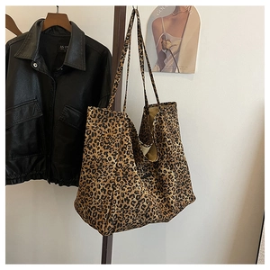 Detailed view of leopard print tote bag with large capacity and slim shoulder straps