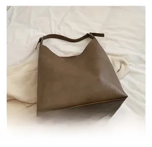 Detailed view of the dark brown vintage tote bag with textured matte faux leather finish