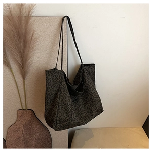 Close-up of leopard print tote bag with soft texture and slim shoulder straps