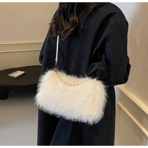 Detailed close-up of fluffy white faux fur texture and elegant pearl handle strap