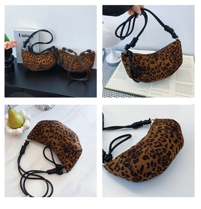 Detail of leopard print crescent bag with knotted rope strap and suede texture