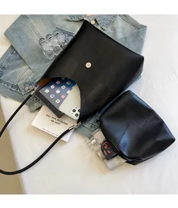 Internal view of black patchwork leather hobo bag showing large storage capacity