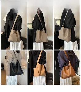 Detail view of large tote bag sets with matching coin purses in various leather colors