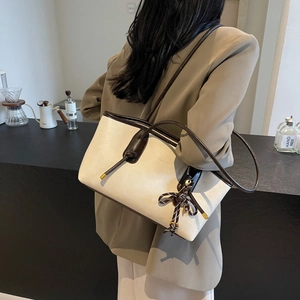 Minimalist off-white large capacity tote bag with brown contrast straps for women