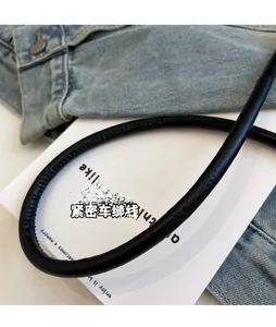 Detail of comfortable black leather shoulder strap with high-density precision stitching