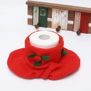 Christmas Santa hat toilet paper roll cover in red fabric with festive green leaf details