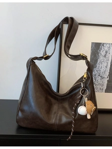Large dark brown leather Hobo bag with baseball charm and wide shoulder strap