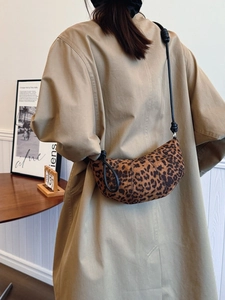 Chic leopard print half-moon crossbody bag with elegant knot strap detail for women