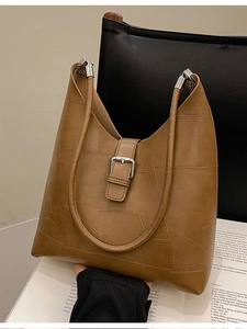 Retro patchwork brown faux leather shoulder bag with spacious design and silver buckle
