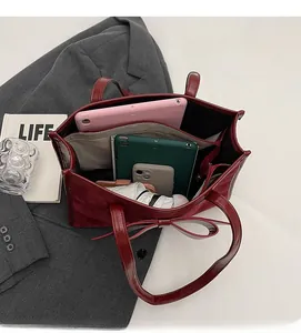 Top view of large capacity suede tote bag with bow detail showing spacious interior