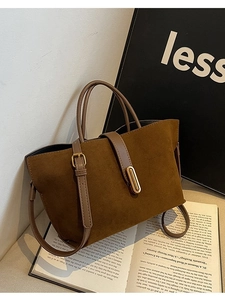 Brown faux suede tote bag with golden lock and dual handles in minimalist chic style