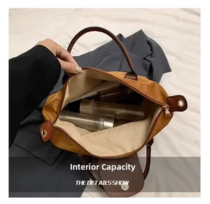 Detail view of large capacity nylon tote interior showing skincare bottles storage