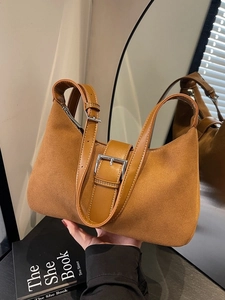 Retro caramel brown suede underarm bag with adjustable leather strap and silver buckle
