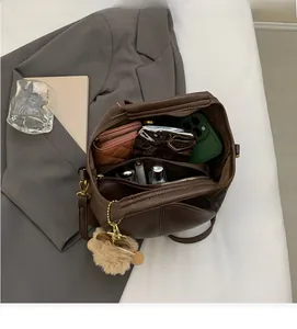 Interior view of brown leather tote bag with spacious compartments and everyday essentials