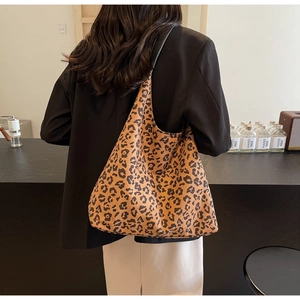 Detail of large leopard print tote bag with high-quality fabric texture in a lifestyle setting