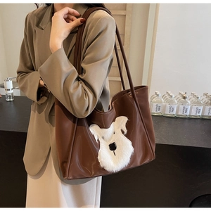 Brown PU leather tote bag featuring a cute white plush dog patch and long shoulder straps