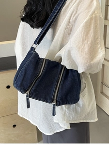 Large capacity dark blue denim tote bag with decorative zippers and wide shoulder strap