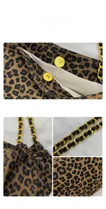 Close-up of leopard print tote featuring gold magnetic clasp and chain shoulder strap