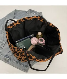 Interior view of leopard print tote bag showing large capacity for tablet and daily items