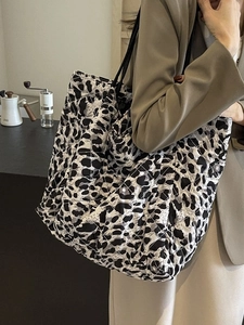 Quilted leopard print tote bag with black shoulder straps for urban commuting style