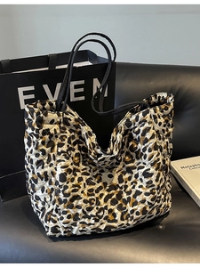 Quilted leopard print tote bag with large capacity and sleek black shoulder straps