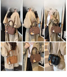Viste dettagliate della borsa Boston vintage in marrone scuro, marrone chiaro e nero
