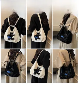 Vues détaillées du sac à dos cabas en toile à double usage avec broderie de chat noir mignon